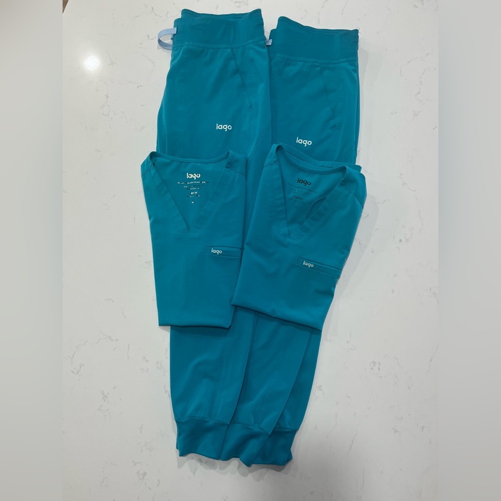 Two, yes, 2 Teal Scrub Sets